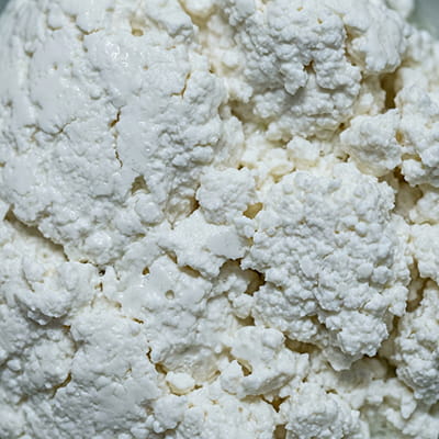 Fresh Indian cottage cheese, frozen bulk export format.