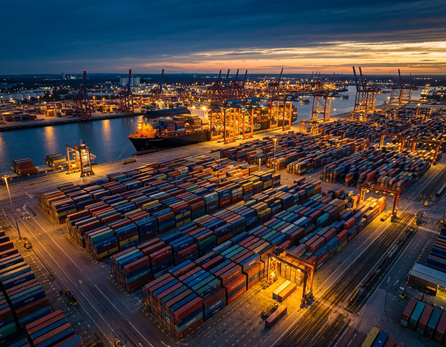 Aerial view of a massive international shipping port highlighting global cargo and export logistics.