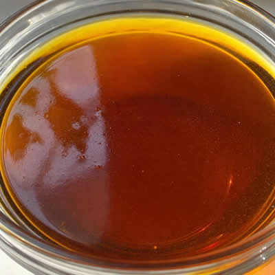 Rich dark amber pure mustard oil for global export